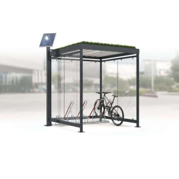 Gerenderde afbeelding van een prefab fietsenhok met sedumdak, geïntegreerde LED-verlichting op zonne-energie, hoog-laag fietsenrek, ESG glazen wanden en een frame in RAL 7016.