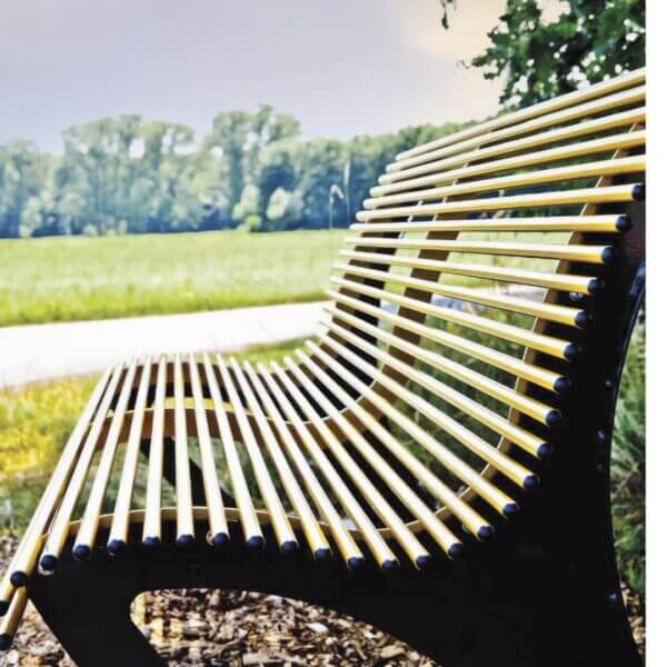 parkbank van metaal kleur zwart geel bestellen Parkbank van staal kleur antraciet met zitgedeelte in kleur geel en geplaatst in een landelijk gebied